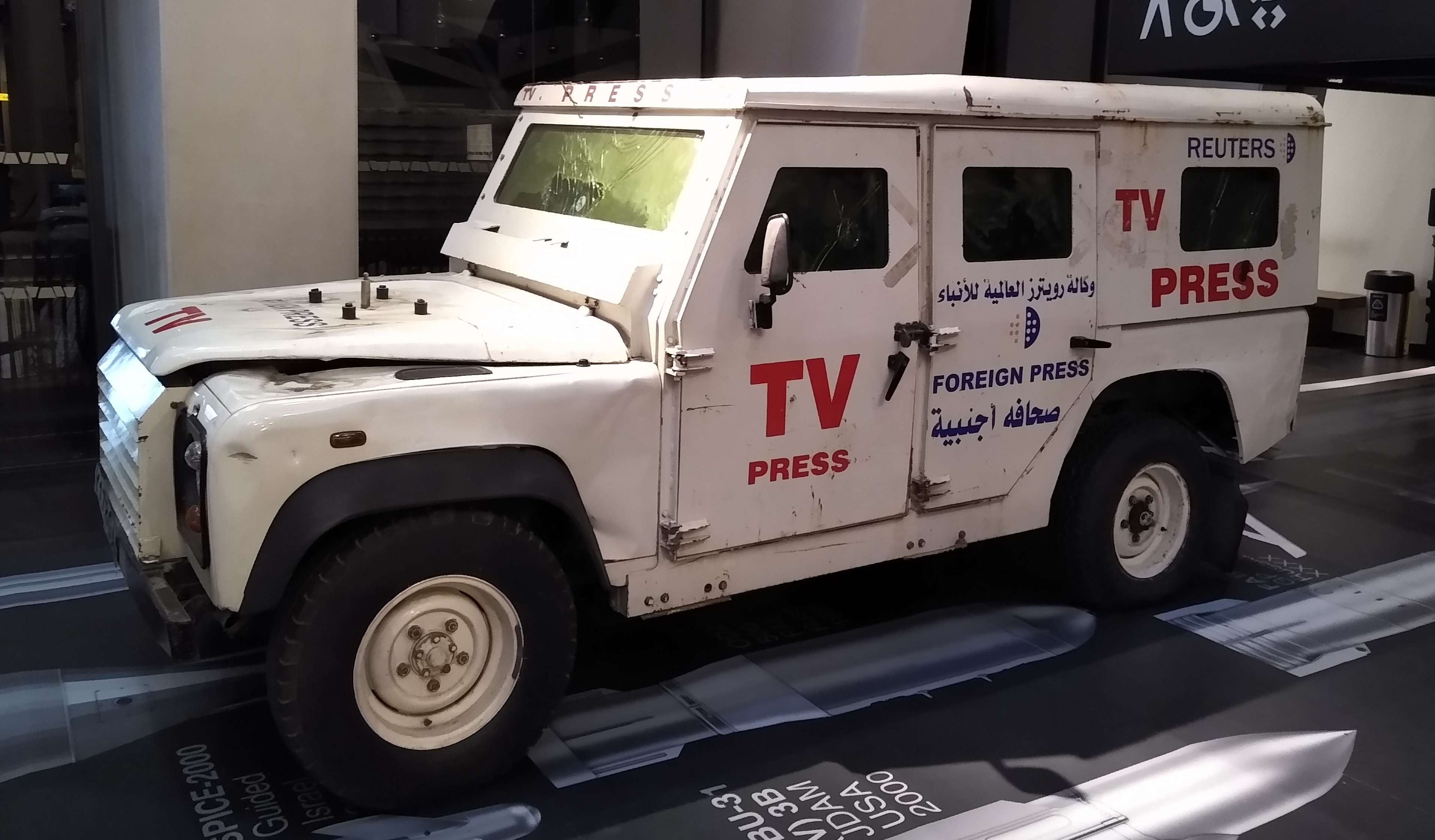 The Reuters armoured Land Rover damaged by an Israeli rocket in Gaza in 2006, on display at the Imperial War Museum, London